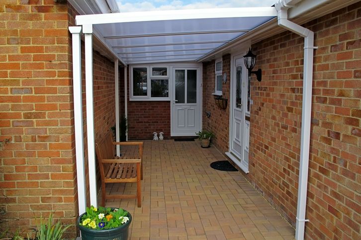 White Simplicity polycarbonate door canopy over a side entrance