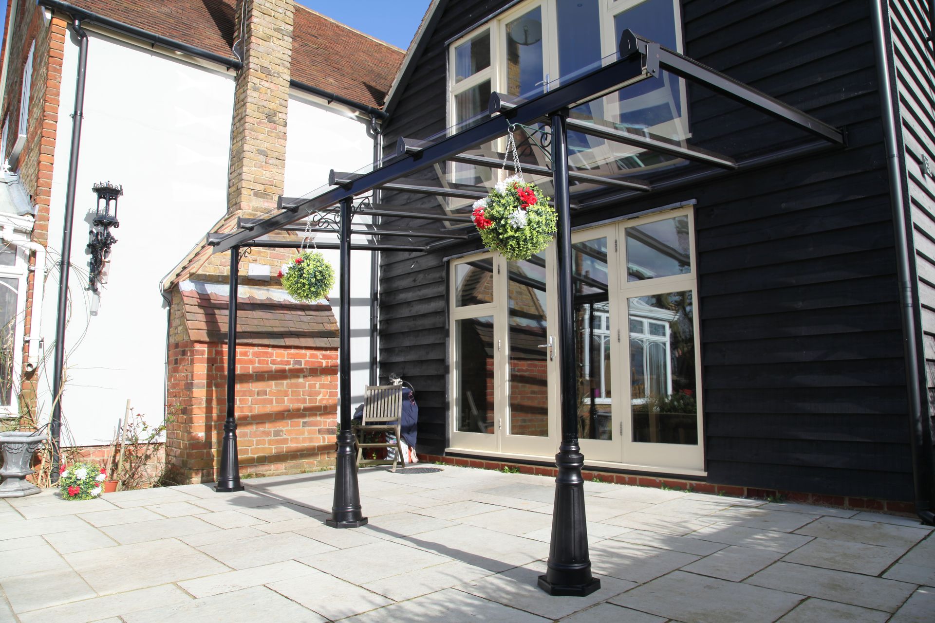 Glass door canopy above a residential front entrance