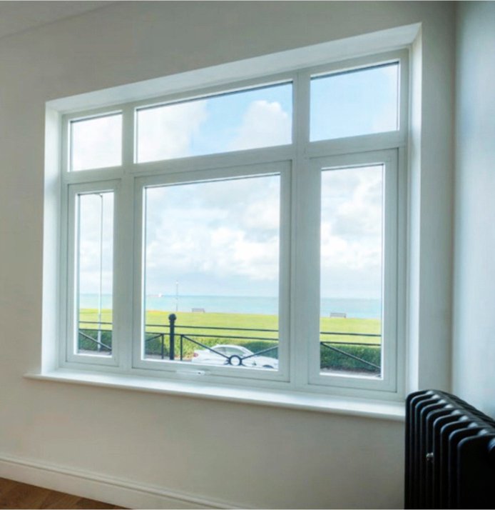 Modern white uPVC casement windows on a British home